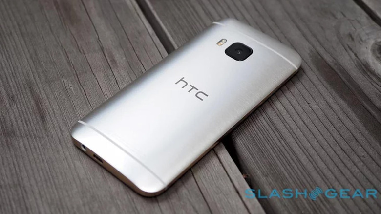 An HTC One M9 on wood planks