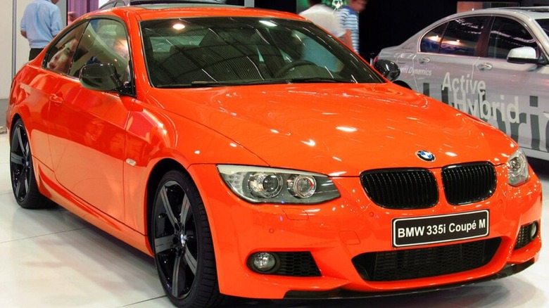 An orange BMW 335i M Coupe 2011