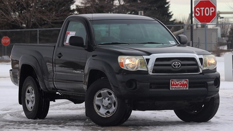 Black 2010 Toyota Tacoma parked on snow