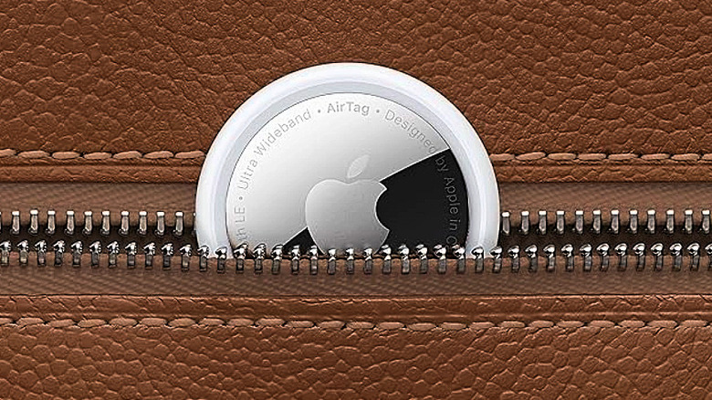 An Apple AirTag tucked into a zipper pocket.