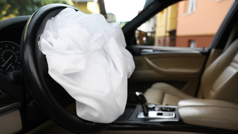 A deployed airbag on the steering wheel