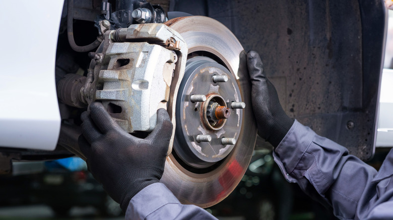 Mechanic holding brakes
