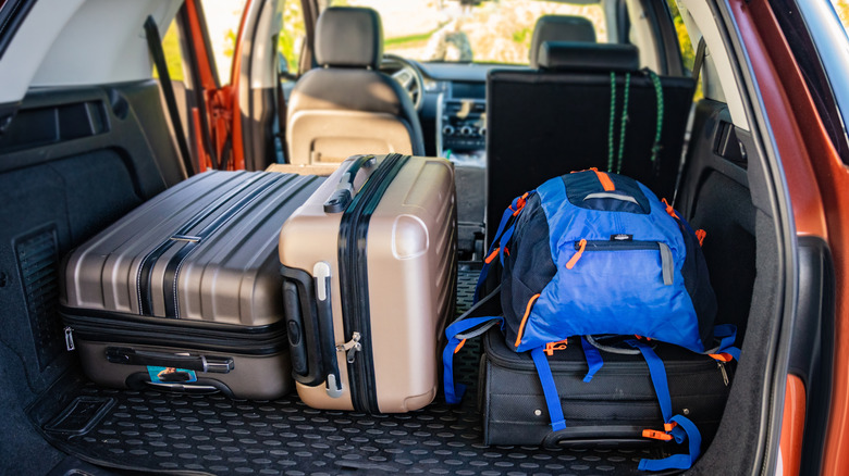 Car trunk loaded with bags and suitcases