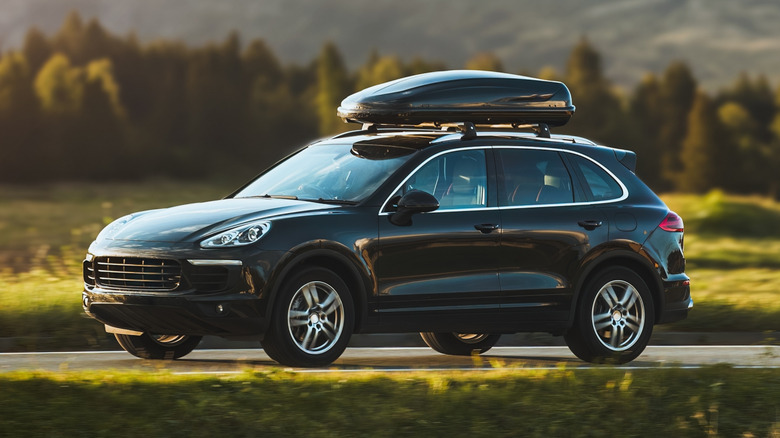 Porsche SUV with a roof rack