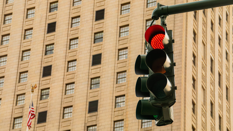 Red traffic light in the city