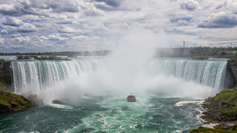 An image of a boat sailing across Niagra Falls  
