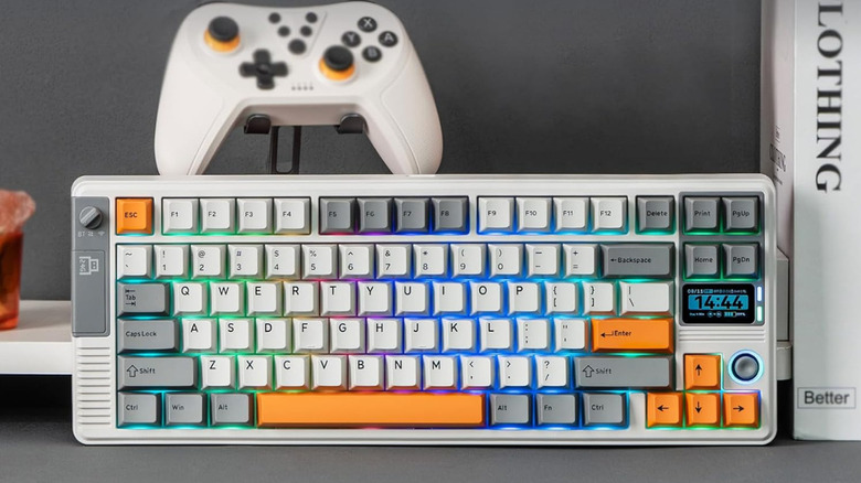 Epomaker RT85 standing upright with a gaming controller above it.