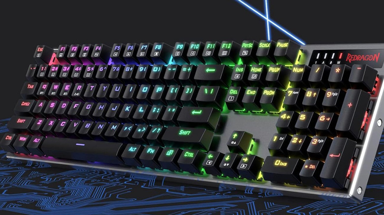 A Redragon K556 Pro with RGB lighting on.