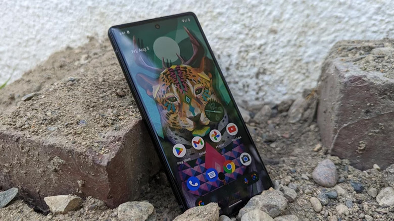 A Google Pixel 6a on some rocks outside