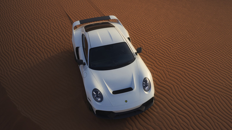 Gemballa Marsien driving across a sand dune