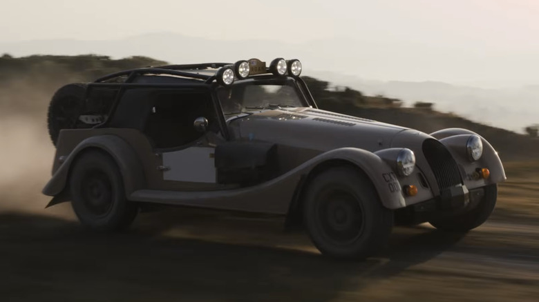 Morgan Plus Four CX-T driving accross a dirt road