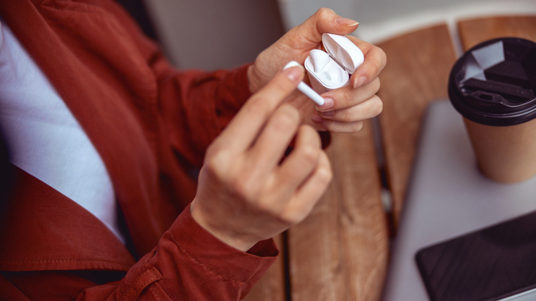 Placing AirPod back in case