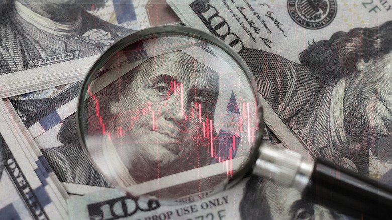 magnifying glass on $100 bill