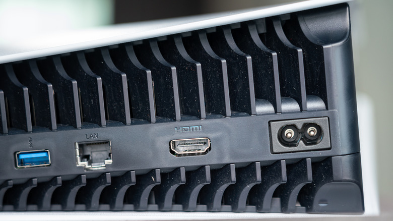 A close-up of the air vent of a PS5 with a bit of dirt on it