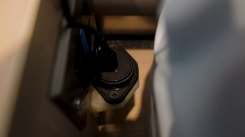 Closeup of Make It Rad's modified USB ports in his Airstream