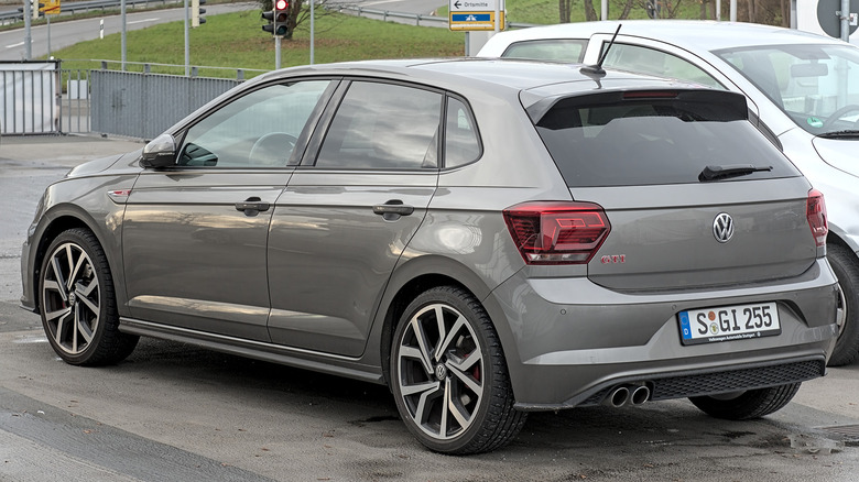 A gray Volkswagen GTI parked in a parking spot