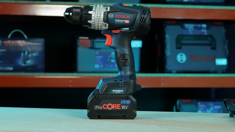 A matte blue GSR 18V-150 C drill from Bosch standing upright on a table with the battery attached.