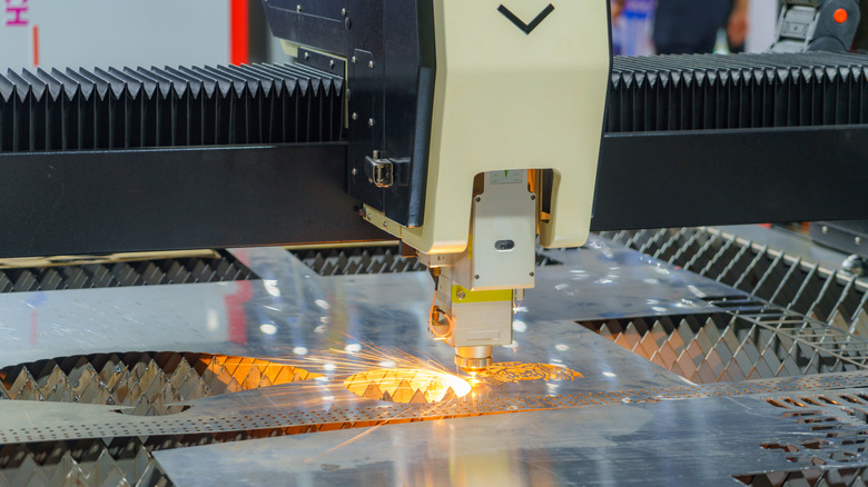 Laser engraving creating a design on metal