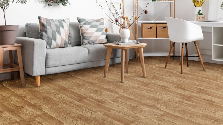 Hardwood floor below a lot of furniture.