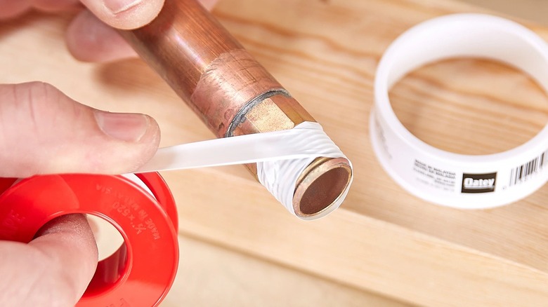 Oatey plumbing tape around pipe threads