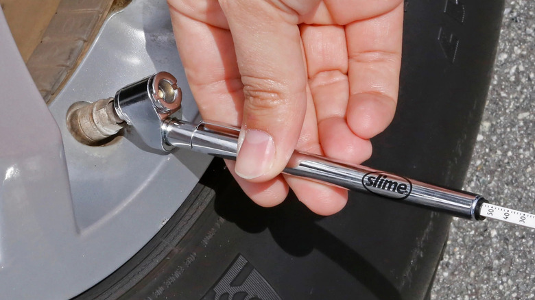 Slime tire gauge on tire