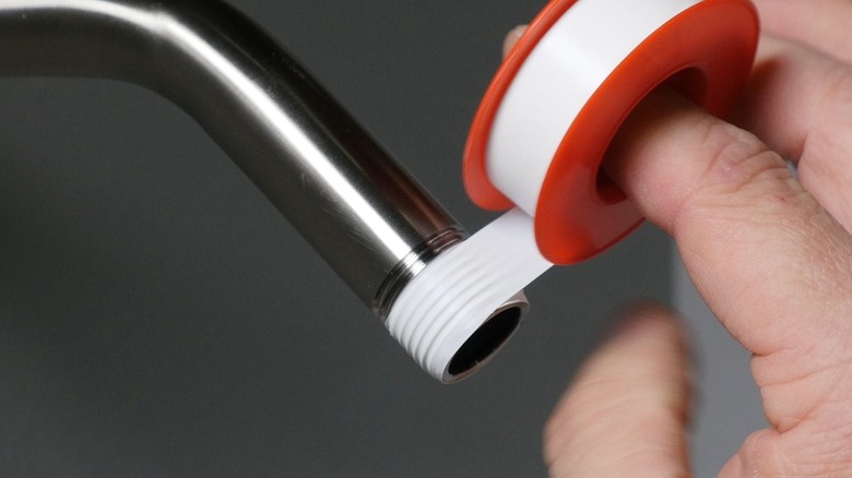 Person using plumbers' tape