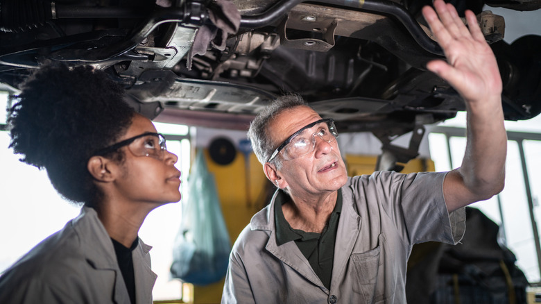 Mechanics wearing safety glasses