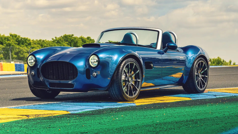 Blue new AC Cobra parked on race track