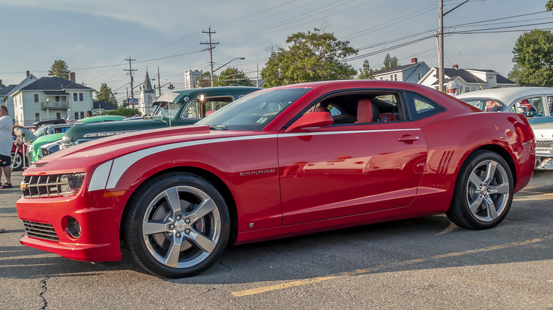 red 2010 chevrolet camaro in parking lot