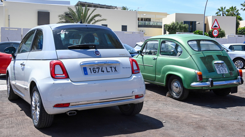 old and new fiat 500s parked next to each other