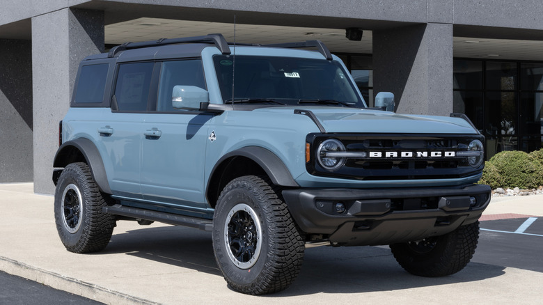 Modern Ford Bronco parked in front of building