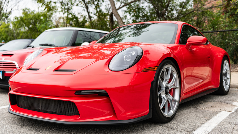 Red porsche 911 front three quarter view