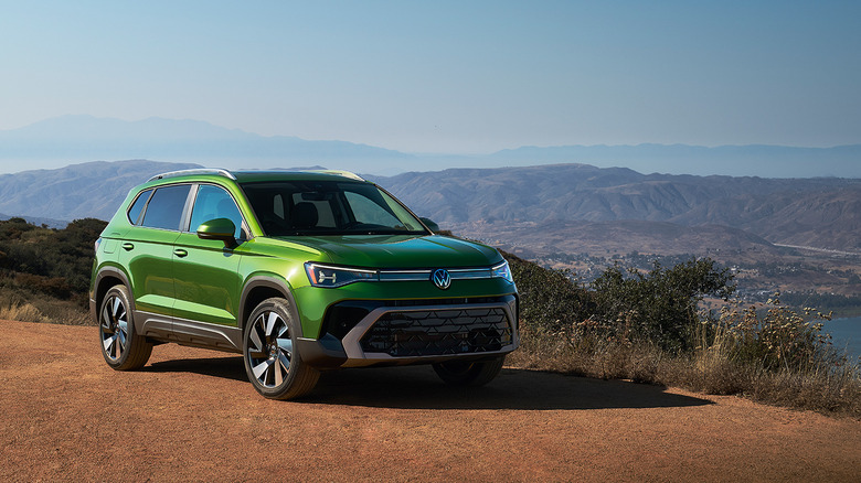 A green 2025 Volkswagen Taos parked
