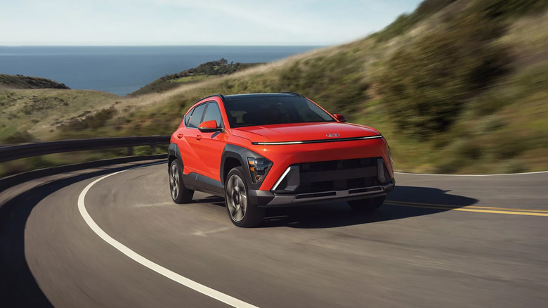 A red 2026 Hyundai Kona driving