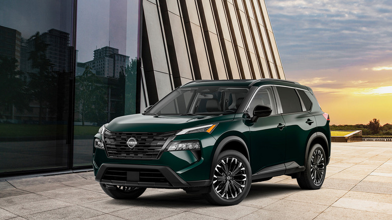 A side-on shot of a green 2026 Nissan Rogue