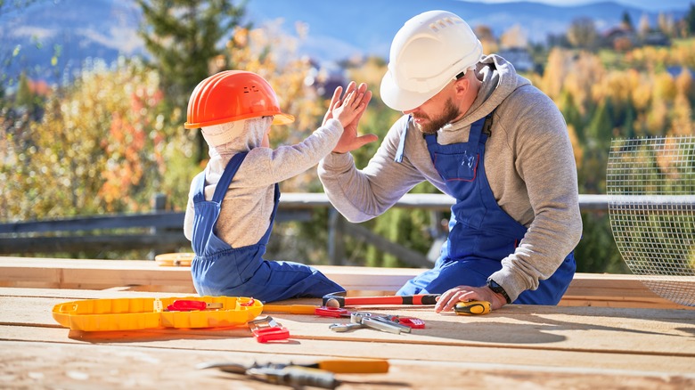 Father and child doing DIY together