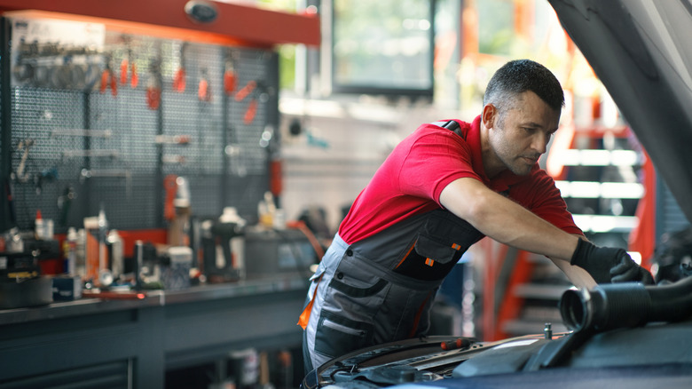 a mechanic working on a car