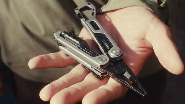 Gerber Stakeout Drive being held by someone with pliers out