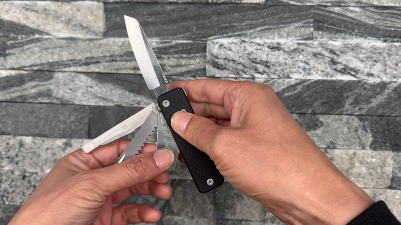 A person unwinding and spreading out the Flex Titan tools