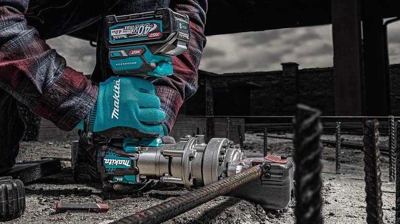 Close up of person using Makita rebar cutter