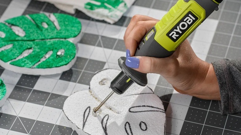 Person using Ryobi foam cutter on foam.