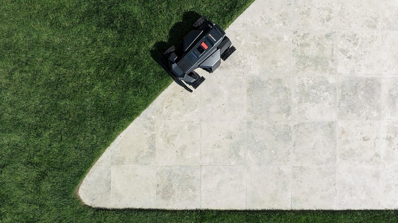 Navimow X450 robot mower cutting around hardscaping