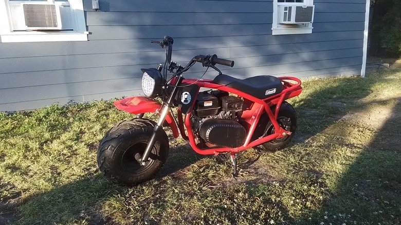 Coleman mini bike near a house