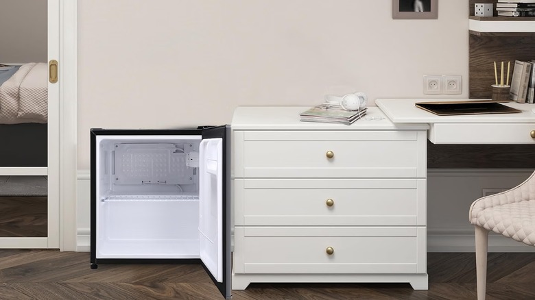 Magic Chef mini fridge in a bedroom