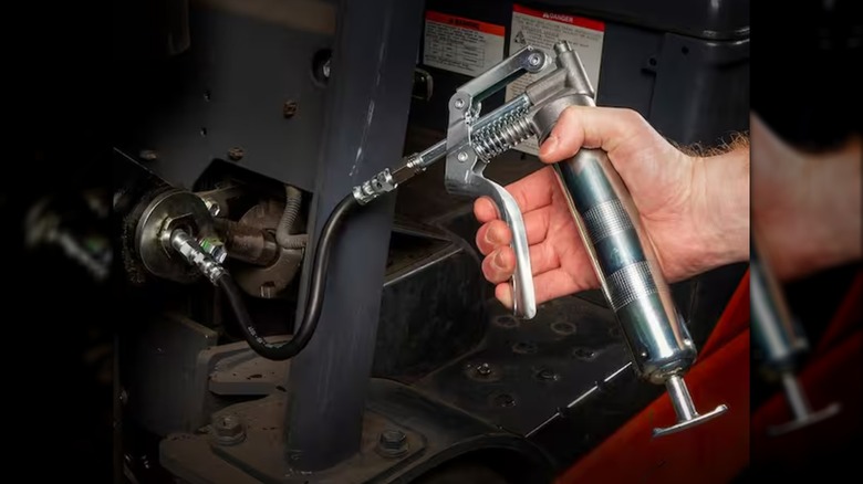 greasing parts with Workforce mini grease gun