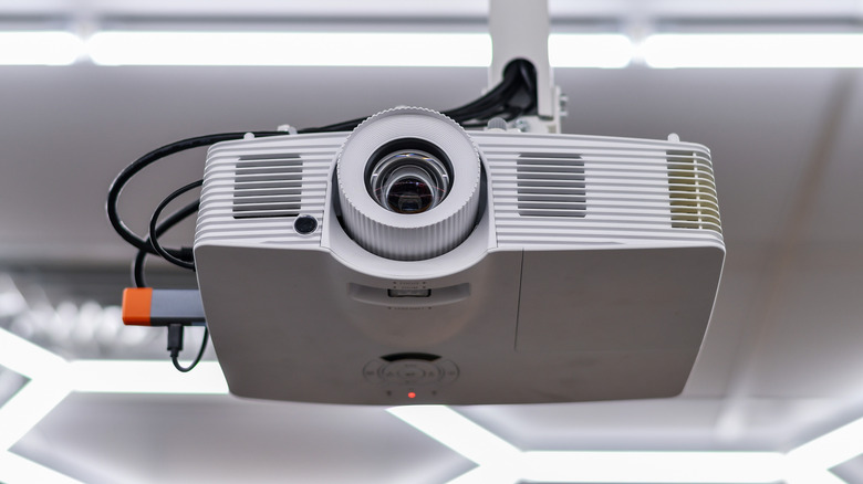 A digital projector mounted on the ceiling
