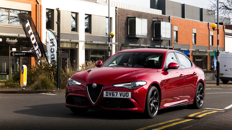 Front 3/4 shot of a red 2018 Alfa Romeo Giulia Quadrifoglio.