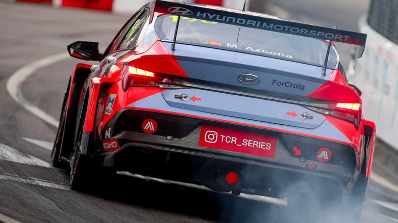 Rear shot of a 2025 Hyundai Elantra N TCR racing around a track.