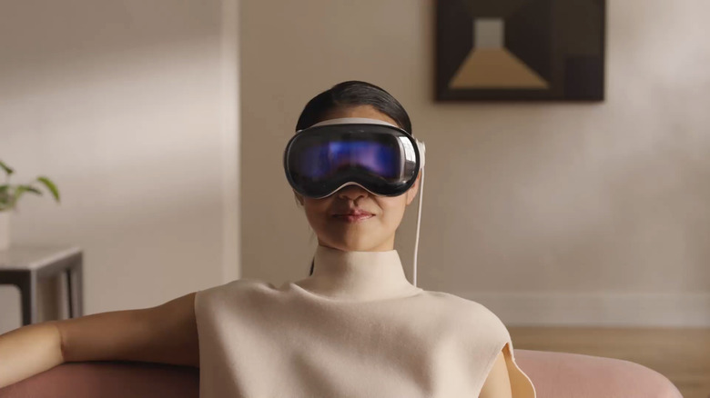 A person wearing the Apple Vision Pro VR headset