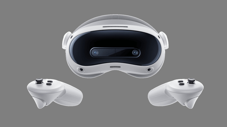 The Pico 4 Ultra VR headset and its controllers on a gray background